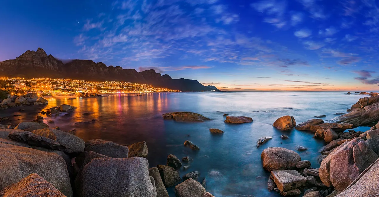 Camps Bay and the Twelve Apostles lit up at dusk